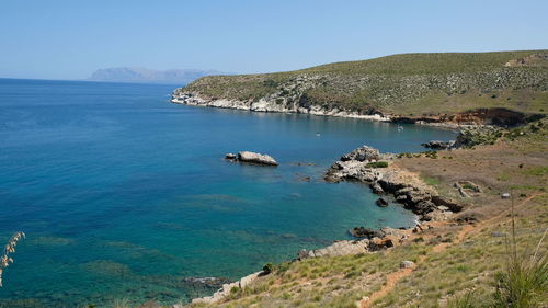 High angle view of bay against clear sky