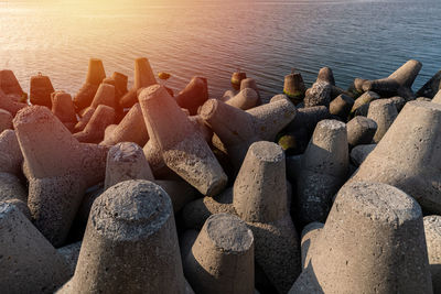 High angle view of rocks on sea shore