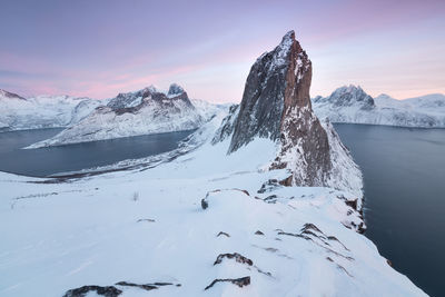 Scenic view of snowcapped mountains against sky during sunset