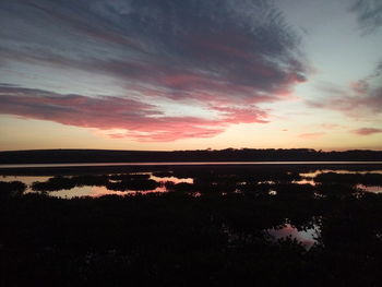 Scenic view of lake against romantic sky