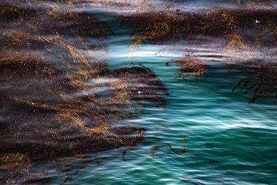 High angle view of water flowing over sea