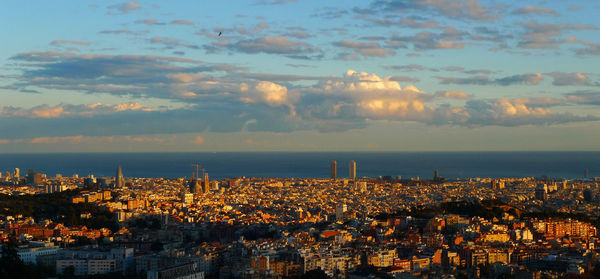 High angle shot of townscape with calm sea in background