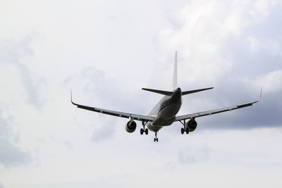 Low angle view of airplane flying in sky