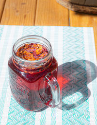 High angle view of glass jar on table