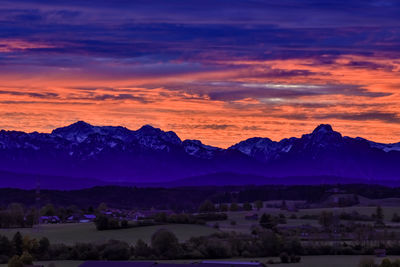 Scenic view of mountains against sky at sunset