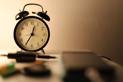 Close-up of clock on table