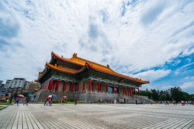 Group of people in temple against building