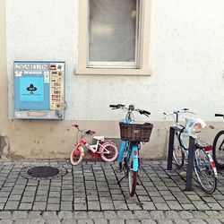 Bicycle leaning against window