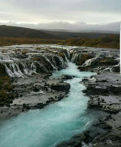 Scenic view of river stream against sky