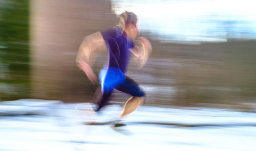 Side view of man running