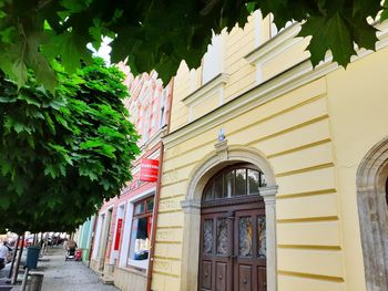 Low angle view of building by street