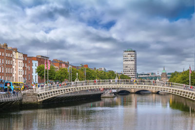 View of liffey river in dublin with ha'penny bridge, ireland