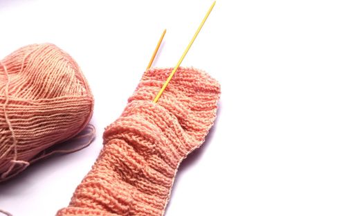 Close-up of wool against white background