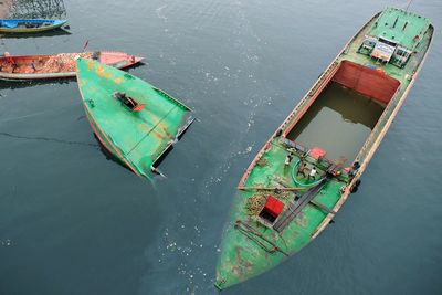 High angle view of boats floating in sea water