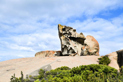 Low angle view of rock formation against sky