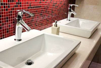 Close-up of faucet in bathroom