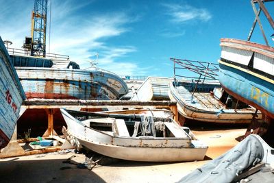 Boats moored at harbor