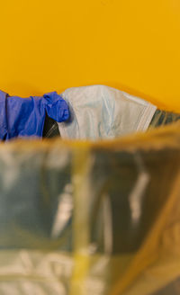 Close-up of yellow fabric on bed at home