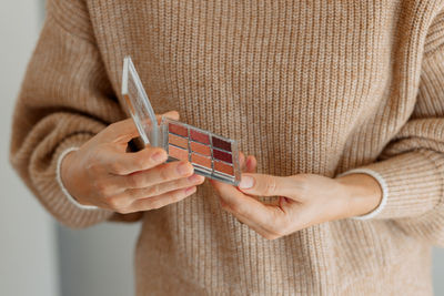 Close-up of woman holding camera