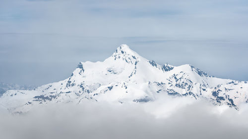 Scenic view of snowcapped mountain against sky