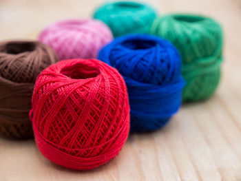 Close-up of colorful wool balls on table