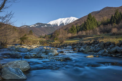 Scenic view of river and mountains