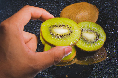 Close-up of hand holding fruits