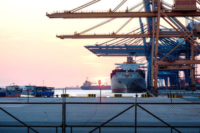 Pier at harbor against sky