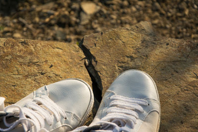 High angle view of shoes on rock