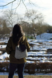 Rear view of woman wearing warm clothing during winter