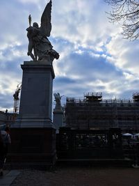 Low angle view of statue against sky