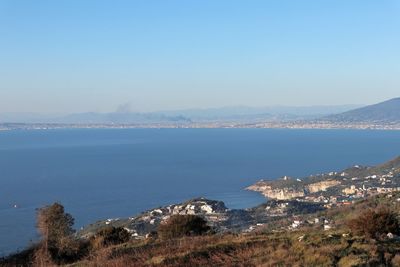 Scenic view of sea against blue sky