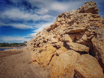 Rock formation on land against sky