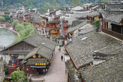 High angle view of street amidst buildings in town