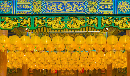 Low angle view of multi colored lanterns for sale