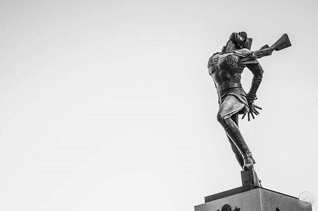 human representation, copy space, clear sky, statue, sculpture, art and craft, art, low angle view, creativity, architecture, built structure, building exterior, day, outdoors, high section, no people, studio shot, white background