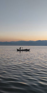 Scenic view of sea against clear sky during sunset