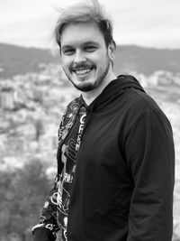 Portrait of young man standing outdoors