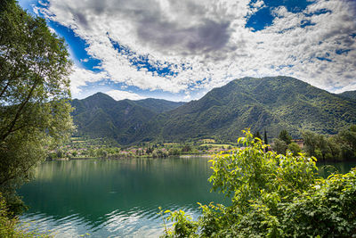 Scenic view of lake and mountains against sky