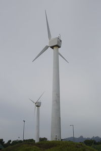 Low angle view of wind turbine against sky