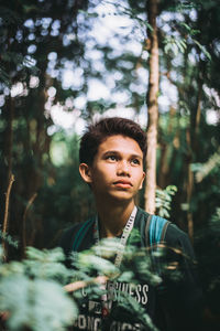 Portrait of young man in forest