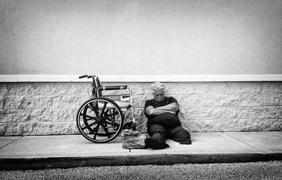 Man sitting on tiled floor