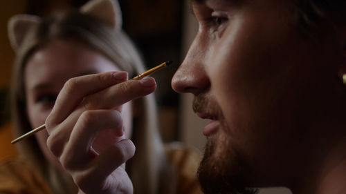 Close-up of man smoking