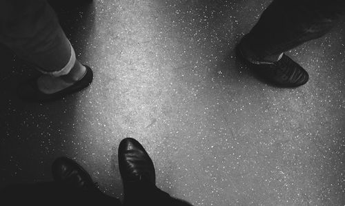Low section of men standing on floor