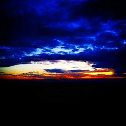 Silhouette of landscape against dramatic sky