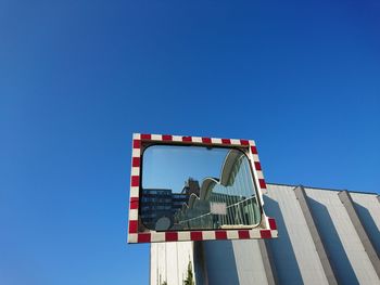 Low angle view of built structure against clear blue sky