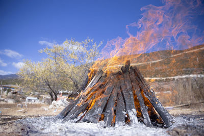 View of bonfire on snow covered land