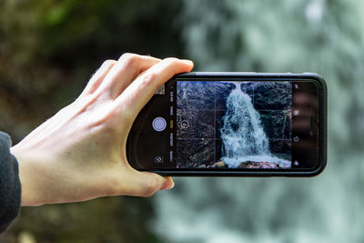 Midsection of person photographing