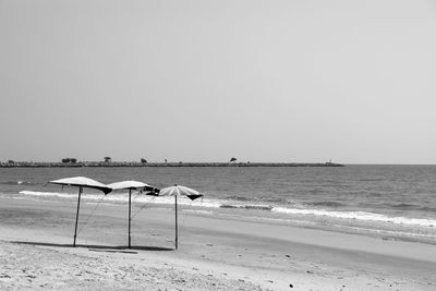 Scenic view of beach against clear sky