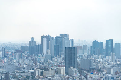 Modern buildings in city against sky